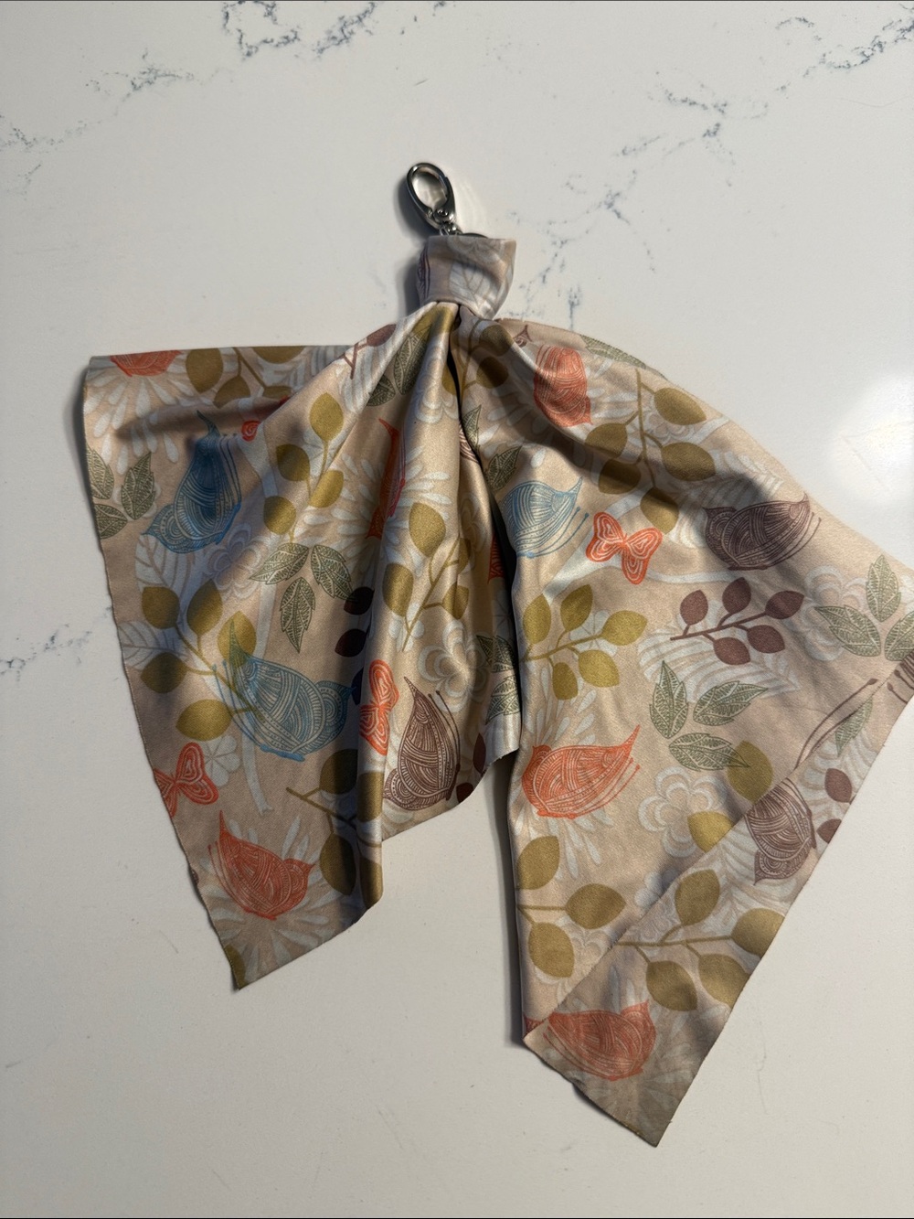 Norwex Leaf & Bird Accent Scarf in Beige with Green, Blue, Orange, Brown Motifs